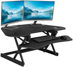 Rocelco 46" Height Adjustable Corner Standing Desk Converter with AC Outlet and USB Charger - Sit Stand Up Dual Monitor Tabletop Riser Workstation - Large Keyboard Tray - Black (R CADRB-46-ACUSB) by Rocelco